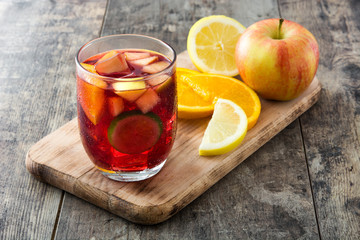 Sangria drink in glass on wooden table

