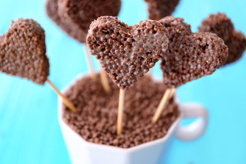 Heart shaped crispy dessert in cup, closeup