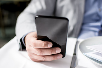 Business Man Using Mobile Smart Phone Close Up