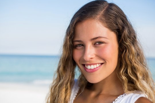 Portrait of beautiful smiling woman at beach