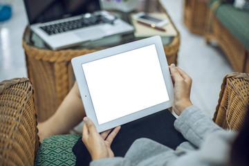 Beautiful business working woman using Ipad while working with laptop