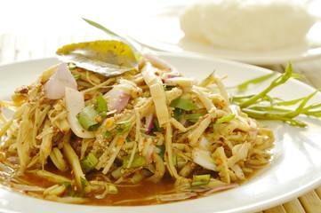 spicy slice bamboo shoot salad in Thai northeastern style eat with sticky rice