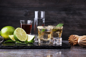 Selection of alcoholic drinks on rustic stone plate