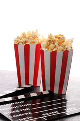 Cinema concept with popcorn in red white bag