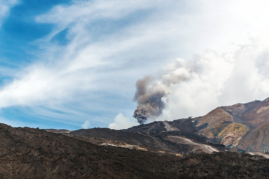 Mount Etna erupting with cloud of ash