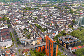 Naklejka premium High top view of many roofes of city houses from Dusseldorf Rhine Tower in summer sunny day. Germany