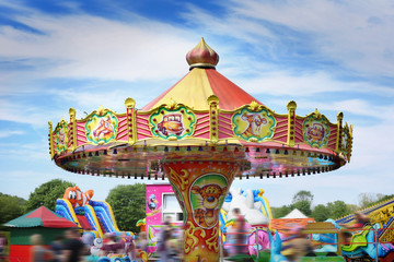 Obraz premium Colorful carousel in attraction park. Carousel for little children.