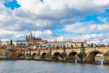 Aerial view of Charles Bridge (Karluv Most) over the Vltava river. This is a famous historic and touristic bridge in Prague.