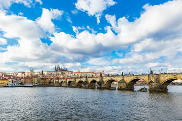 Aerial view of Charles Bridge (Karluv Most) over the Vltava river. This is a famous historic and touristic bridge in Prague.