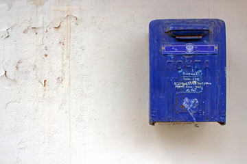 Mailbox on an old dirty wall