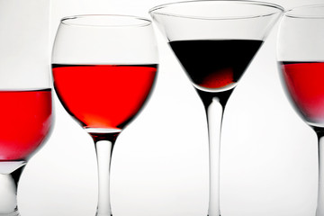 four glasses of red wine on it is white background and and place for text background