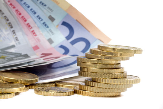 money euro coints and banknotes on white