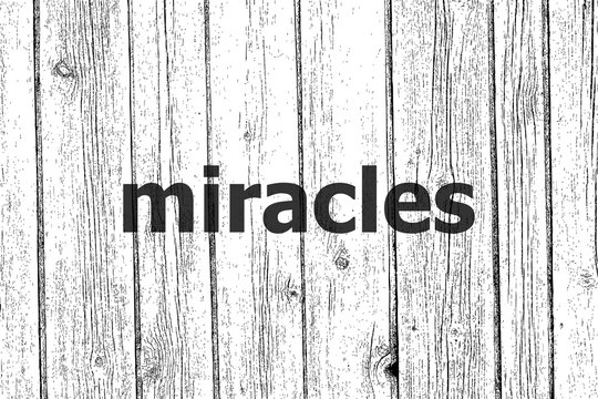 Text Miracles. Business concept . Wooden texture background. Black and white