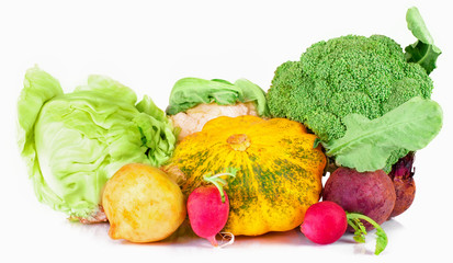 vitamin set of vegetables from cabage the  large turnip, beets, zucchini orange and yellow with green sprigs radish bright and fresh green salad leaves of fresh isolated on white background