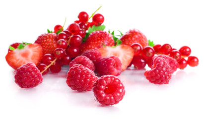 vitamin collection of berries: sour a currant, ripe red a strawberry with leaves and a sweet raspberry isolated on a white background