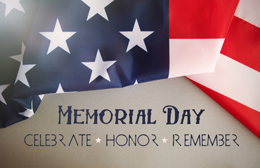 Text Memorial Day on American flag background. toned image card 