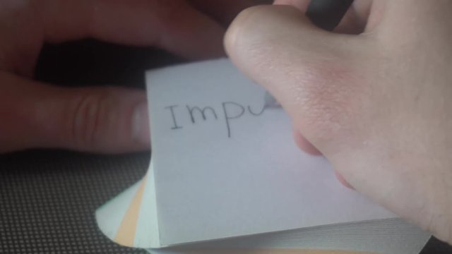 Changing the word impossible to possible. Impossible word gets the ''im'' removed to make it possible. Pencil erase it to possible.