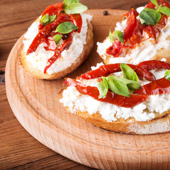 Italian sandwiches - bruschetta with cheese, tomato and basil