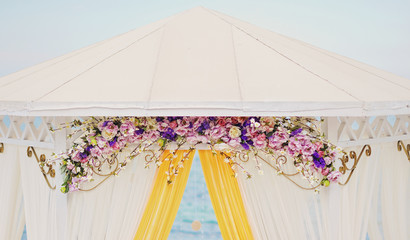 wedding arch from multi-colored flowers