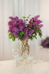 violet bouquet of a lilac on a white table