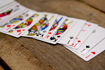 deck of cards on old vintage table focus