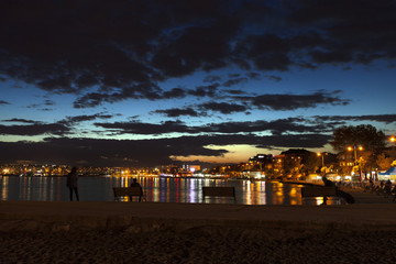 Fototapeta na wymiar Sunsets and city at the seaside