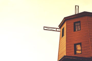 rustic old wooden windmill against the sky