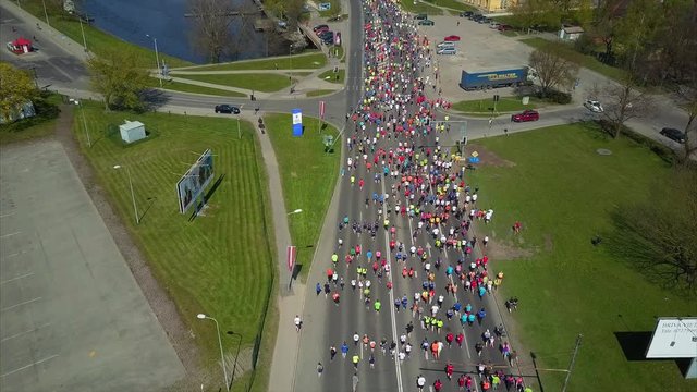 Aerial View of Lattelecom Marathon 2017, Runners run at the Riga International Marathon on May 14, 2017, Riga, Latvia, People run down the Streets between Daugava RIver and Park