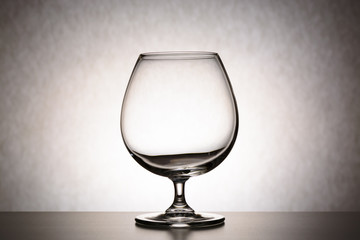 Single empty brandy glass. the concept of emptiness, of purity, thoughtlessness, a crisis of ideas