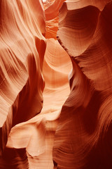 Nature red sandstone textured background Swirls of old red  sandstone wall abstract pattern in Lower Antelope Canyon, Page, Arizona, USA.