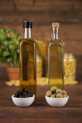 Dry pasta with ingredients on a old wood