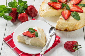 Cottage cheese casserole with coconut, decorated with strawberries and mint