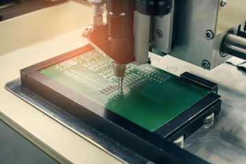 Automation of machine assembly of computer circuit board in the factory for the production of computer components. The process of soldering the board. Factory for the production of microchips.
