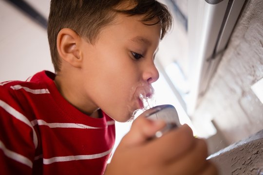 Close up of boy drinking water