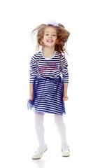 Little girl in a striped dress.