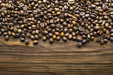 Coffee beans on a wooden background