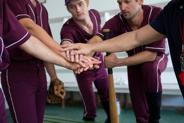 Close up of baseball team doing high five