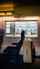 Interior of white luggage bag inside ICE Inter City Express fast german train at Karlsruhe train...
