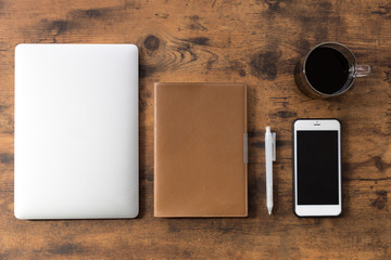 laptop on wooden table