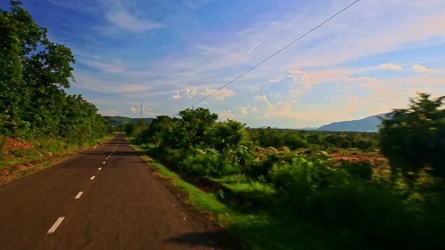 Camera Closely Moves by Metal Barrier against Rural Landscape