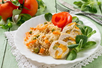 Stuffed chicken roll with spicy rice and vegetables