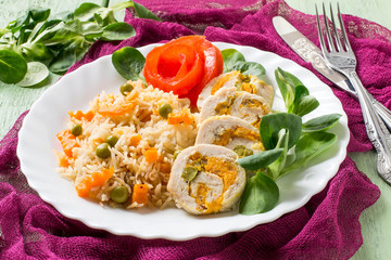 Stuffed chicken roll with spicy rice and vegetables