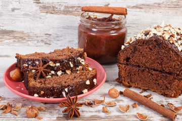 Fresh gingerbread or dark cake with chocolate, cocoa and plum jam, delicious dessert concept