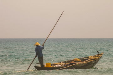 Traditional Vietnamese fishing along the beautiful coastline of Vietnam