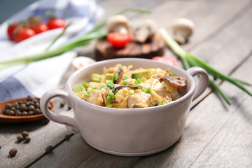 Delicious chicken casserole meal in saucepan on table