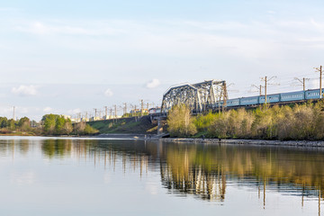 Naklejka premium Railway bridge through the river Berd. Berdsk, Siberia, Russia