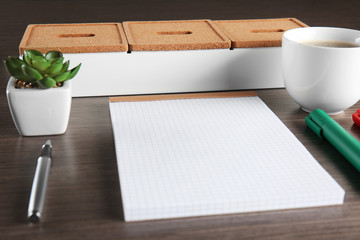 Empty notebook with pen, cup of coffee and accessories on table. Job interview concept