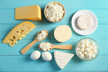 Dairy products on wooden table, top view