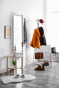 Modern hall interior with hanging clothes