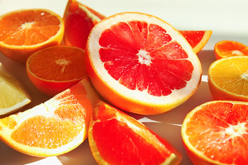 Fototapeta na wymiar Beautiful composition with citrus fruits on white background